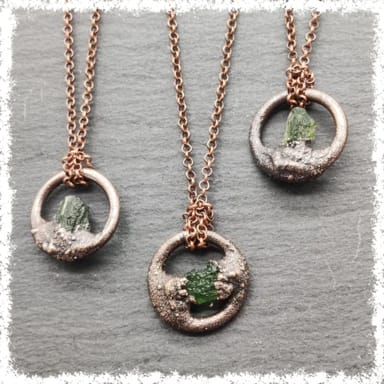 citrine gemstone in copper pendant on chain